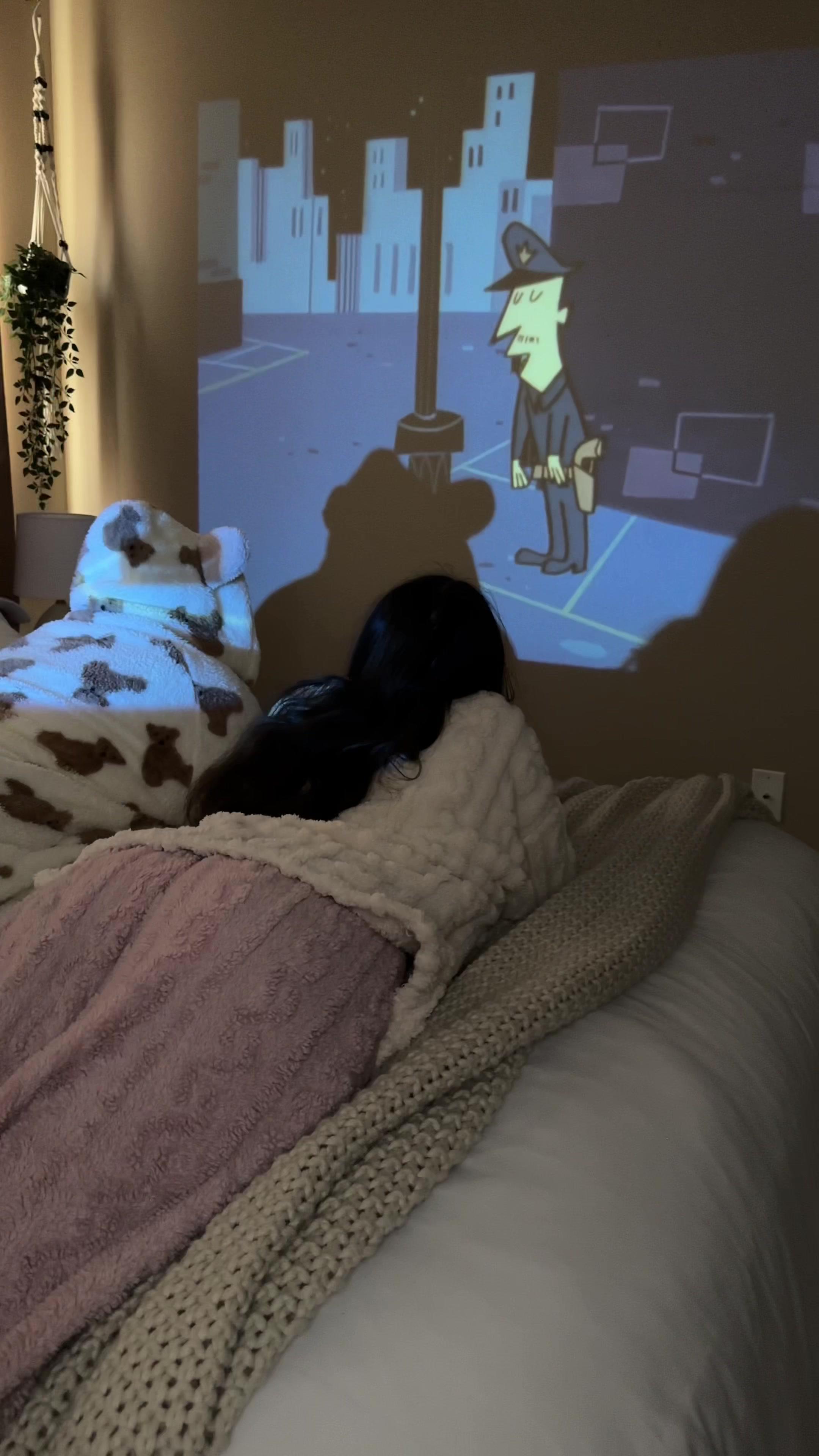 Why settle for a TV when I can have the whole cinematic experience with this amazing projector! 🎥🍿 enjoying my nights like never before! #projector #movienights #homeentertainment #temufinds #movienight #cozyvibes