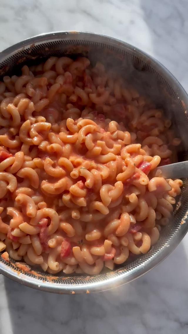 ONE-POT CREAMY BOURSIN PASTA!! Sometimes you need comfort food in minutes, so in those moments I open the @Getir US app to order everything I need to be delivered straight to my door in less than 15 minutes!! Never a wrong time for a pasta party! Use code JAKE for $20 free of groceries just for 2 cents! Creamy Boursin Pasta 2 tablespoons olive oil  1/2 teaspoon crushed red pepper 4 garlic cloves, minced 1 (28-ounce) can crushed tomatoes  3 1/2 cups water 1 pound dried elbow macaroni Kosher salt and freshly ground black pepper 1/2 cup finely grated Parmesan 1 package Boursin cheese (any flavor), crumbled In a medium pot or Dutch oven, combine the oil, crushed red pepper, and garlic over medium-high heat. Cook until the garlic is fragrant, about 1 minute, then add the tomatoes, water, macaroni, and 2 heavy pinches each of salt and pepper. Bring to a simmer. Cook, adjusting the heat to maintain a simmer, until all the liquid is absorbed and the pasta is al dente, 12 to 15 minutes. Remove from the heat and add the parm and Boursin. Stir until well incorporated. Taste and adjust the seasoning with salt and pepper, then serve.  #pasta #boursin #easyrecipes