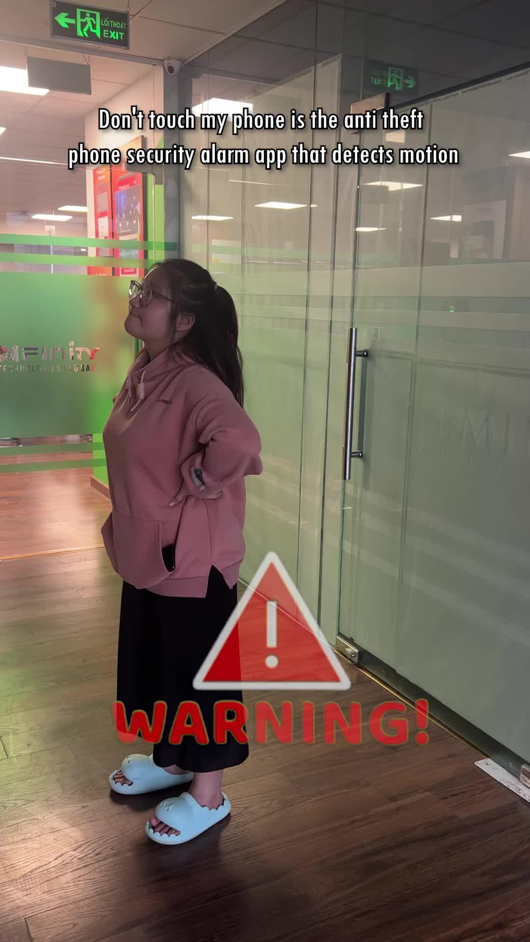 The app warns when someone touches your phone