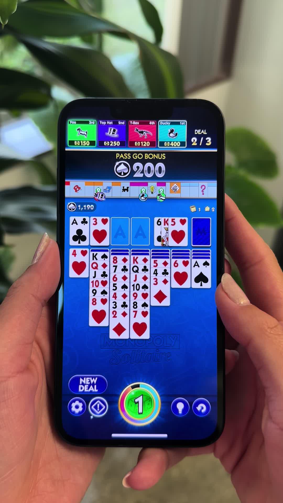 An innovative spin-off of MONOPOLY board games and Solitaire